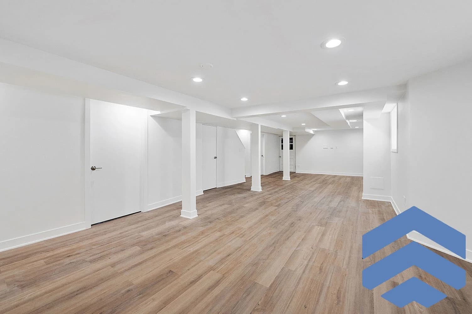 Queens basement renovation with vinyl plank flooring and recessed lighting