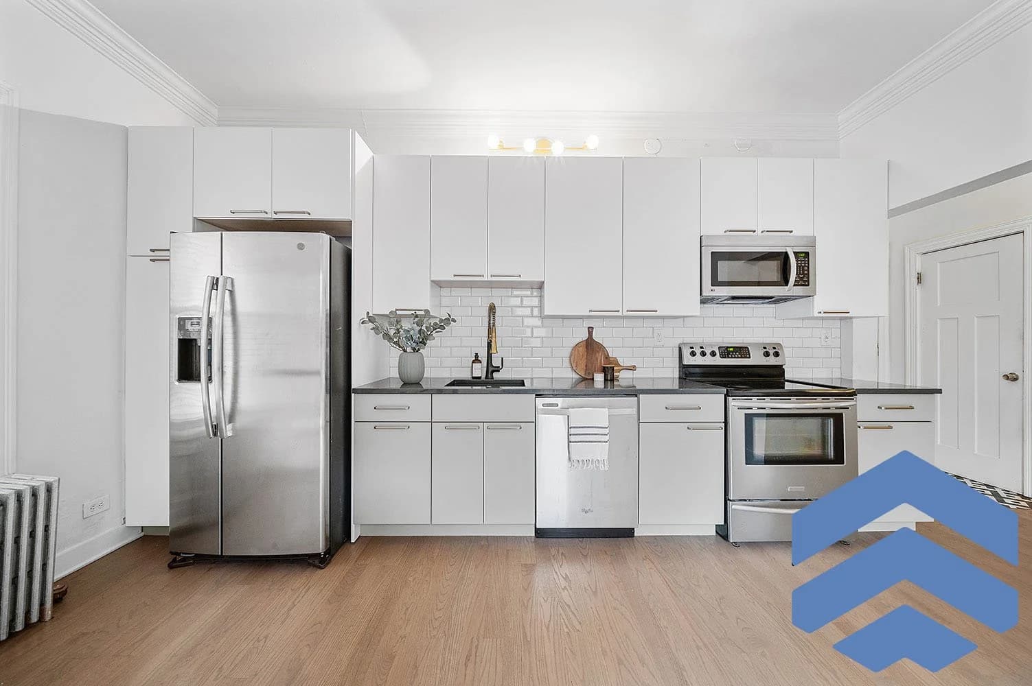 Kitchen renovation with transitional cabinetry and modern finish work