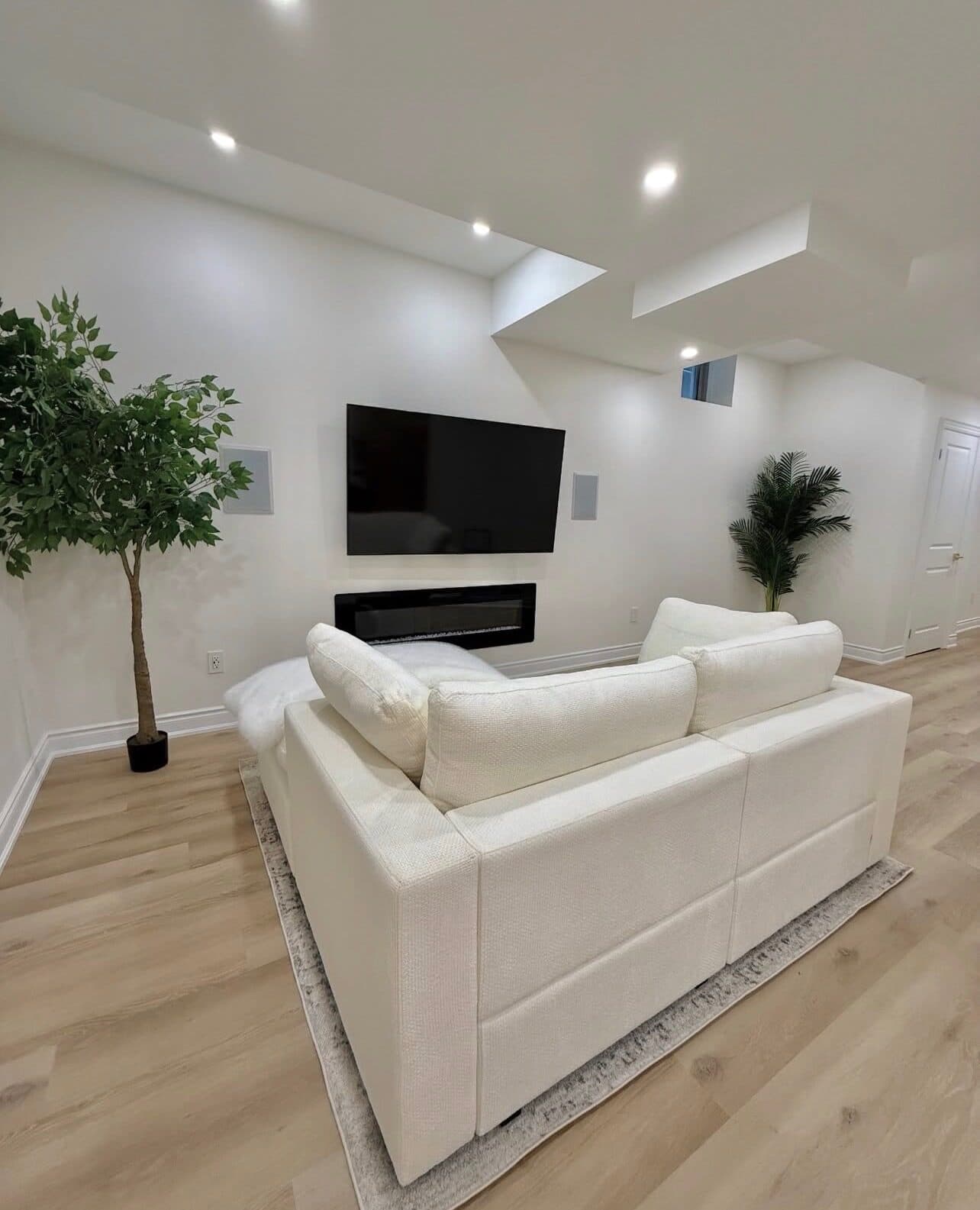 Alternate view of the renovated den with staged greenery