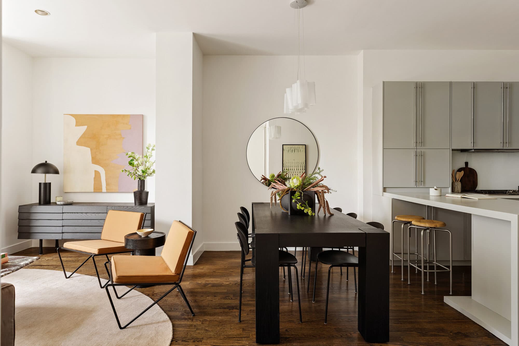 Dining area opening to the kitchen in the renovated apartment