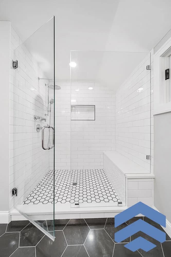 Condo renovation with marble-inspired bathroom finishes and detailed tile work